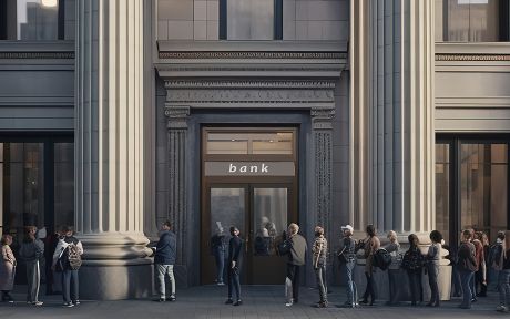People lined up outside a bank entrance in a grand city building