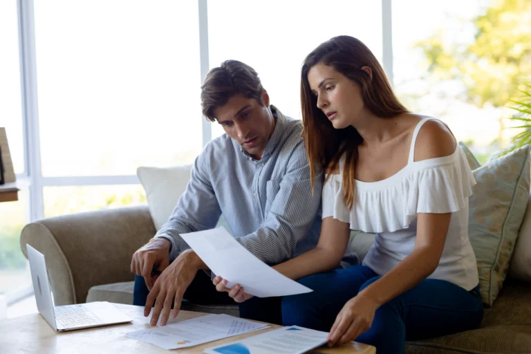 couple reviews documents together at home daytime 2026 01 09 09 37 21 utc (1)
