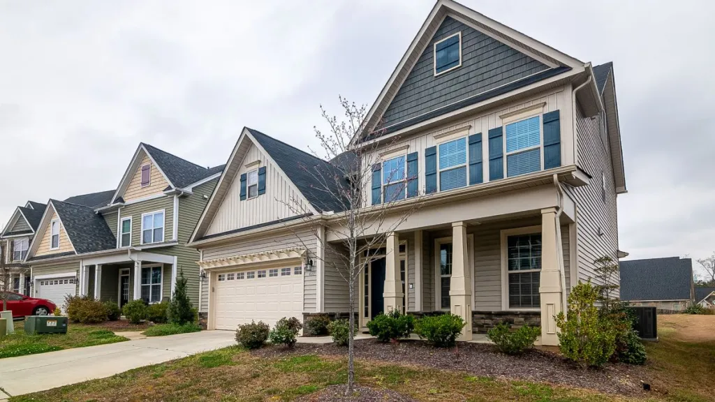 Suburban neighborhood homes with modern houses, garages, and landscaped yards